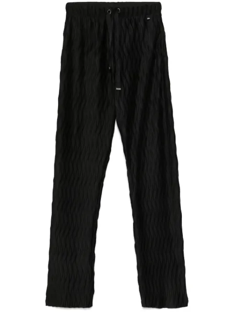 Herno pantalones ajustados con diseño plisado