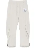 Musium Div. logo-patch trousers - Neutrals
