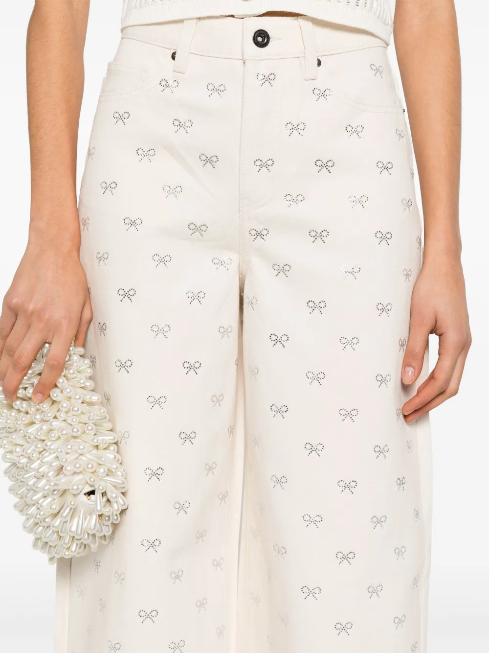Shop Self-portrait Bow-embellished Jeans In Neutrals