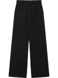 izzue logo-patch trousers - Black