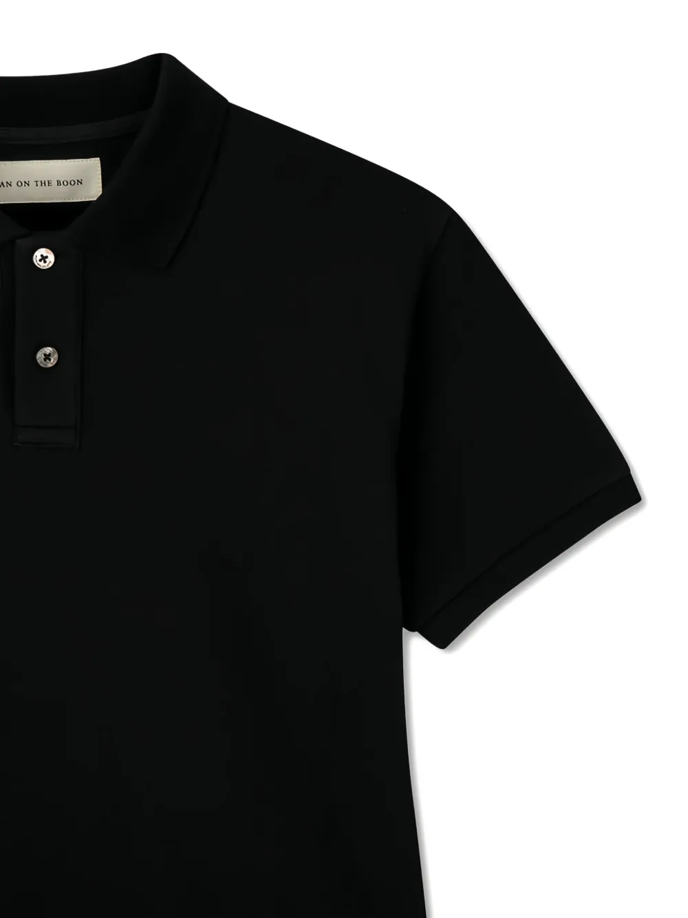 Man On The Boon. Piqué poloshirt Zwart