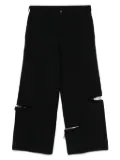 Black Comme Des Garçons distressed trousers
