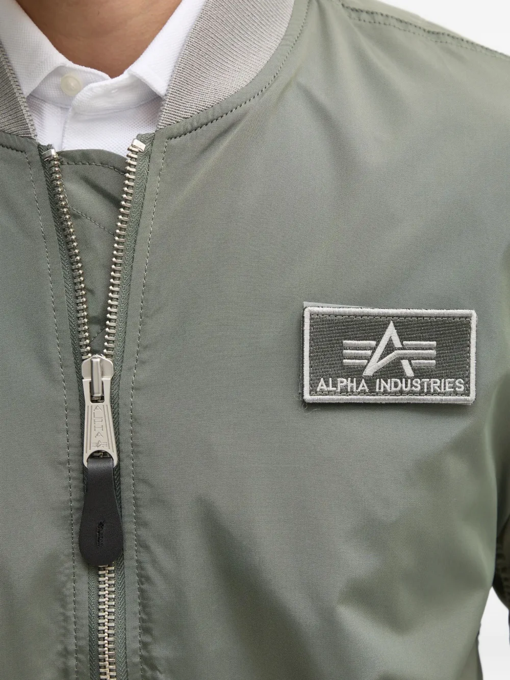 Alpha Industries Bomberjack met ritszak Groen