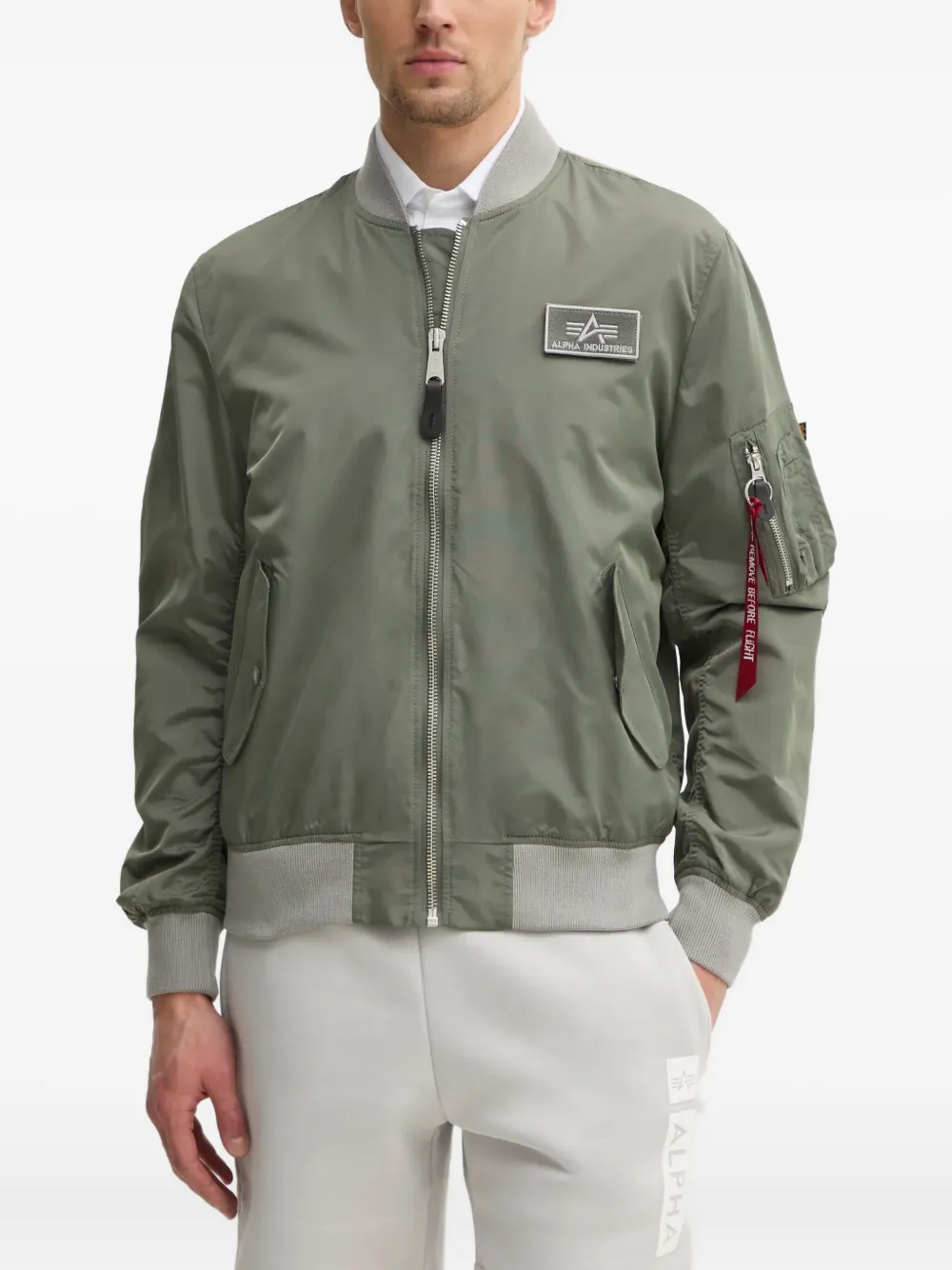 Alpha Industries Bomberjack met ritszak Groen
