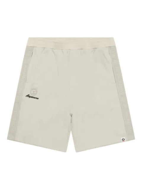 AAPE BY *A BATHING APE® shorts deportivos con franjas del logo