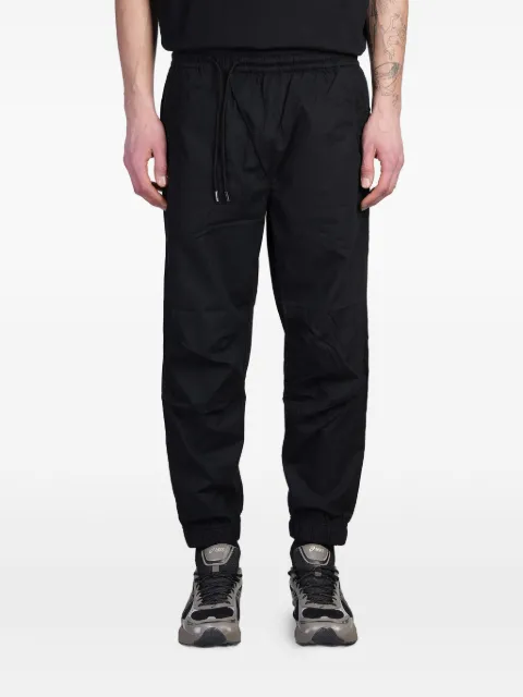 Maharishi pantalones Asym