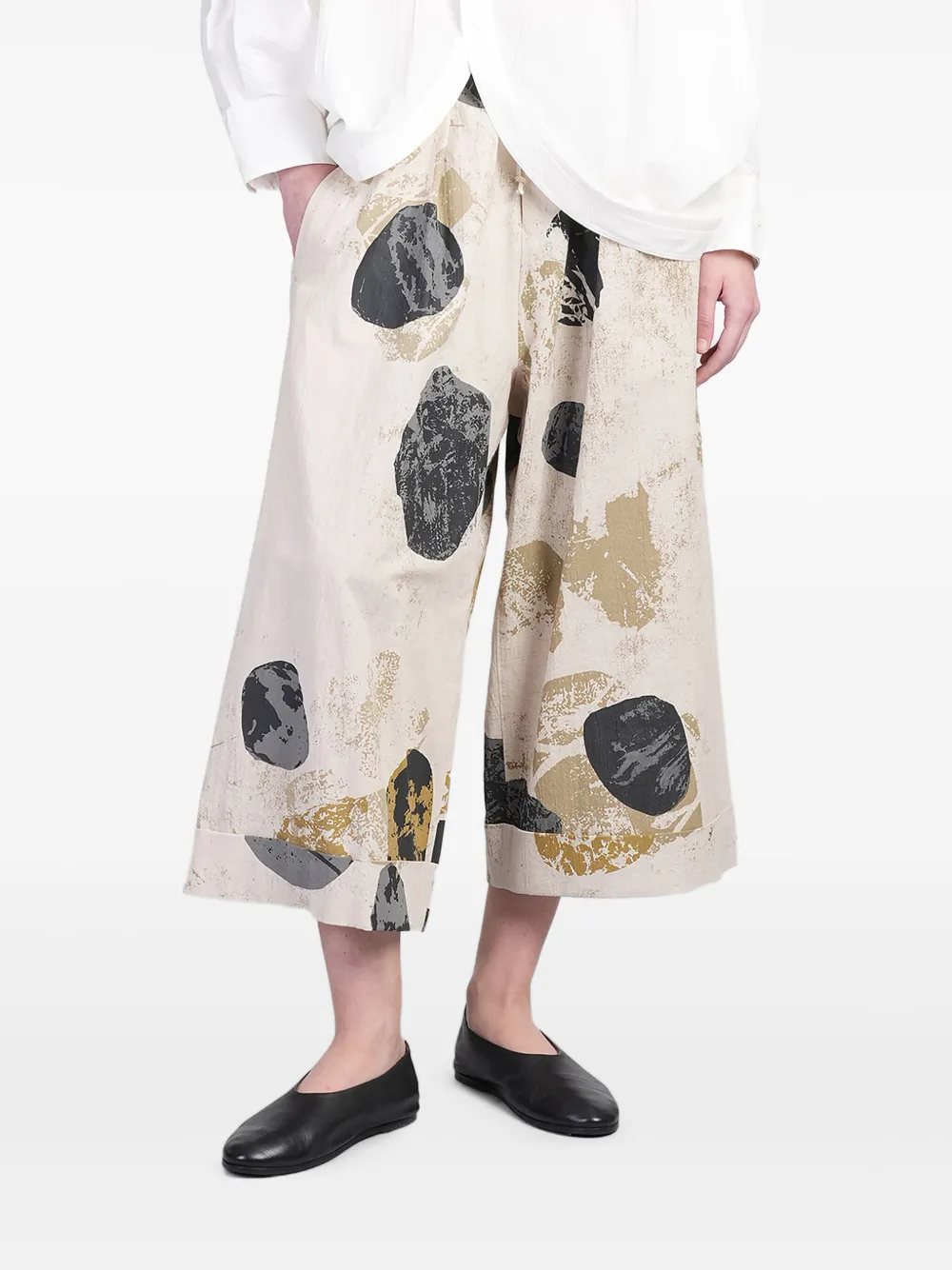 Y's abstract-print trousers Beige