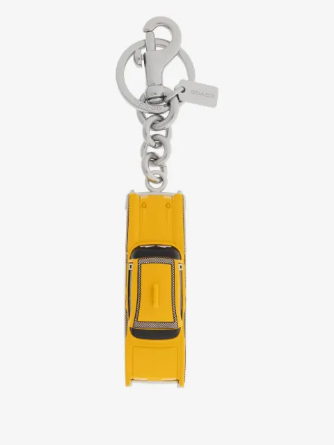 Coach dije para bolsa con motivo de taxi pequeño