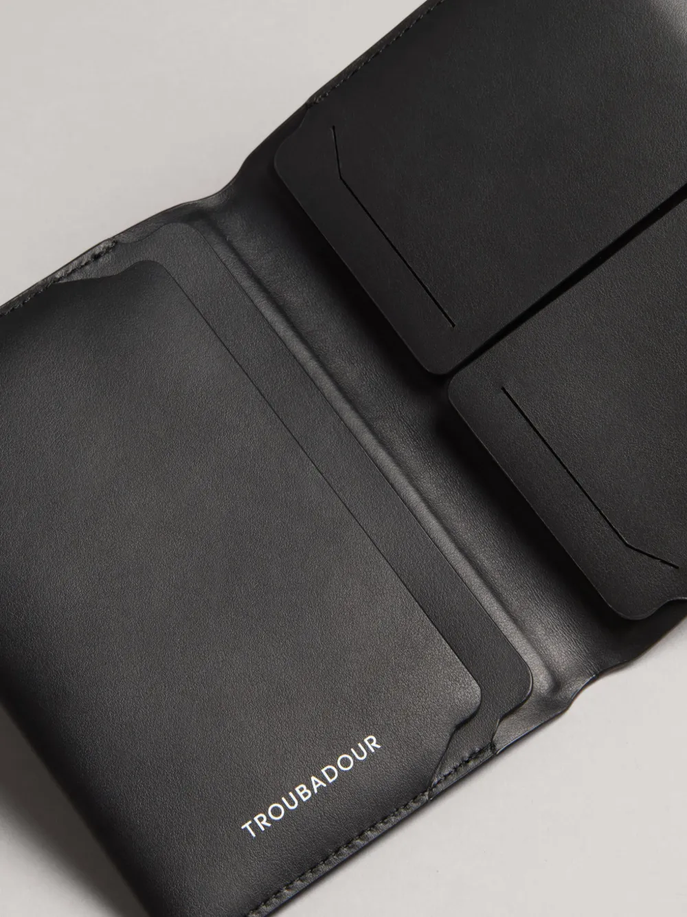 Shop Troubadour Smooth Leather Passport Wallet In Black