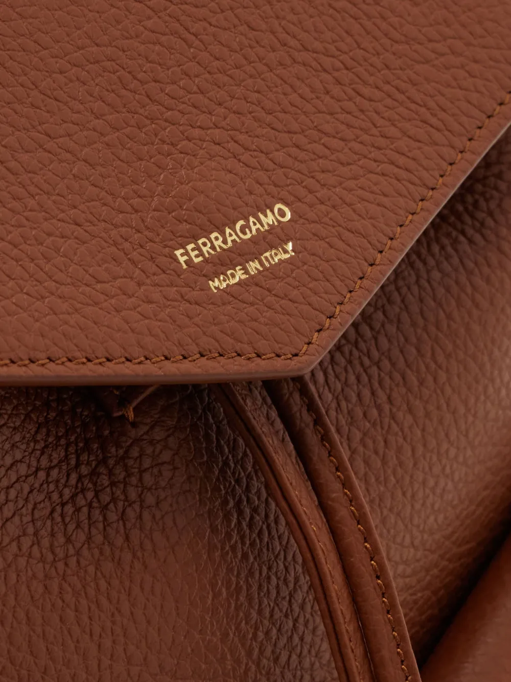 Ferragamo geometric-flap drawstring backpack Bruin