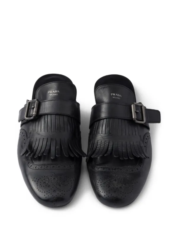 【PRADA】ブローグモチーフ シャッフル フリンジ レザーミュール Prada Shuffle フリンジ レザーミュール | ブラック | FARFETCH JP