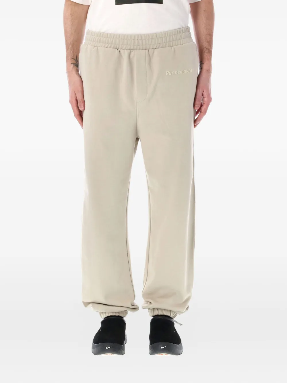 Peacemaker Oamc loose-fit trousers | Neutrals | Image 1