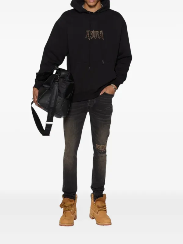 low-rise "Black Wash Blowout" slim jeans
