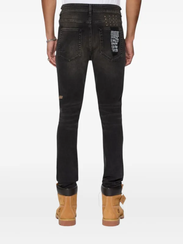 low-rise "Black Wash Blowout" slim jeans