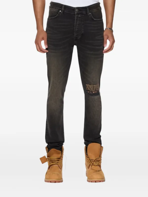 low-rise "Black Wash Blowout" slim jeans