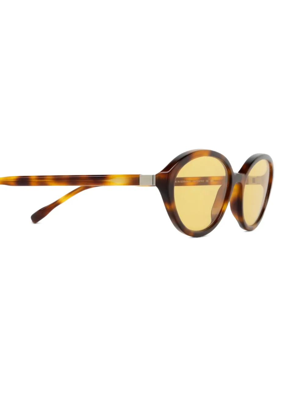 Mykita Zonnebril met ovalen montuur en schildpadschild design Bruin