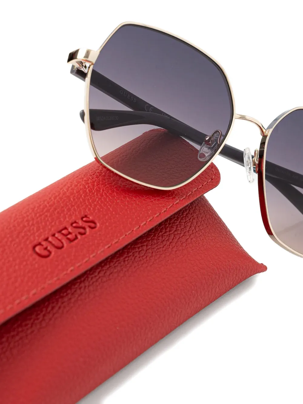GUESS EYEWEAR Zonnebril met geometrisch montuur Grijs