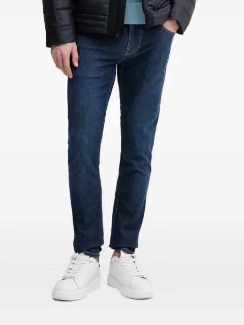 GUESS USA Chris triangle-logo jeans