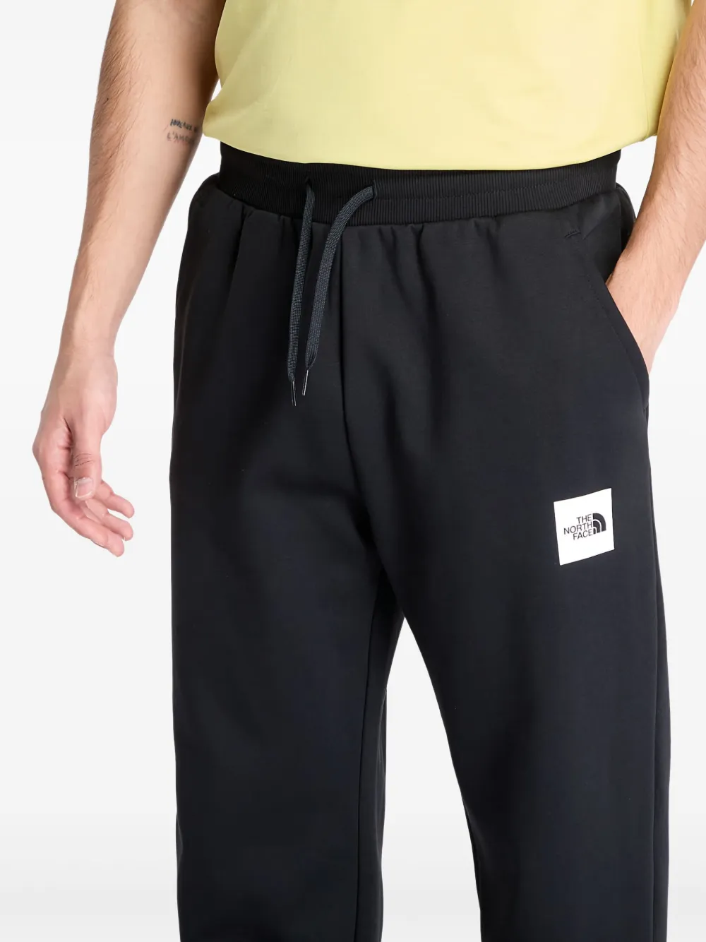 The North Face Joggingbroek met toelopende pijpen en logo Zwart