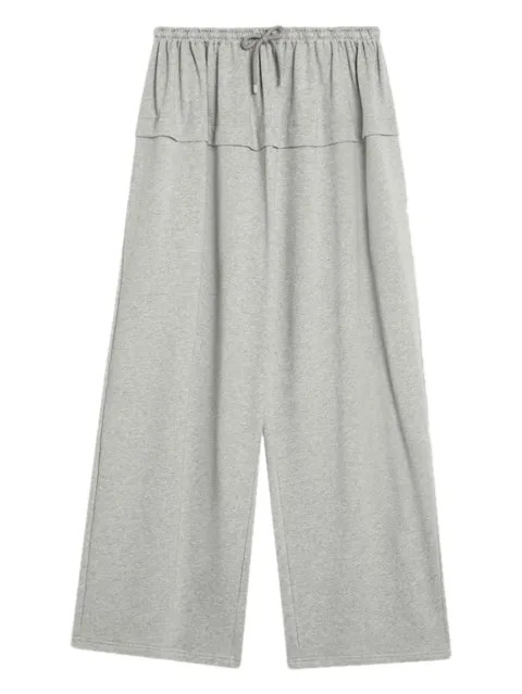 Alaïa pantalones con cordones en la pretina y volantes