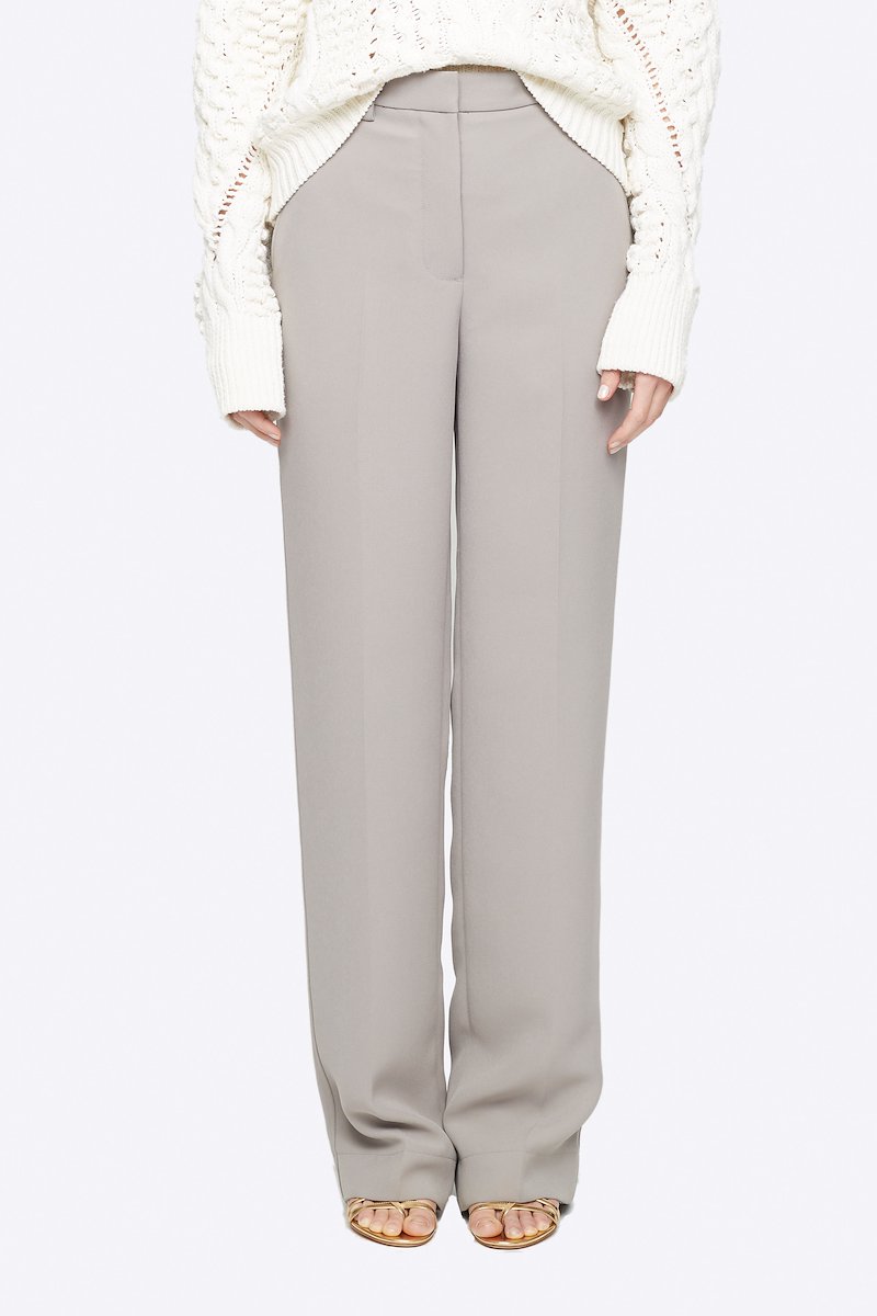 Heavy Cady Relaxed Fit Trouser-grey #0 Heavy Cady Relaxed Fit Trouser, Time to upgrade your office attire game. Cut with a straight fit, these cement grey trousers from 3.1 Phillip Lim are the perfect choice for an instantly put-together look. Level up. Featuring a high waist, belt loops, a concealed front fastening, side slit pockets, back buttoned welt pocket, a straight leg and a long length. POSITIVELY CONSCIOUS: This product is made with a certified eco-material or a recycled material that is better for the planet, so you can be confident you are choosing positively. - 0