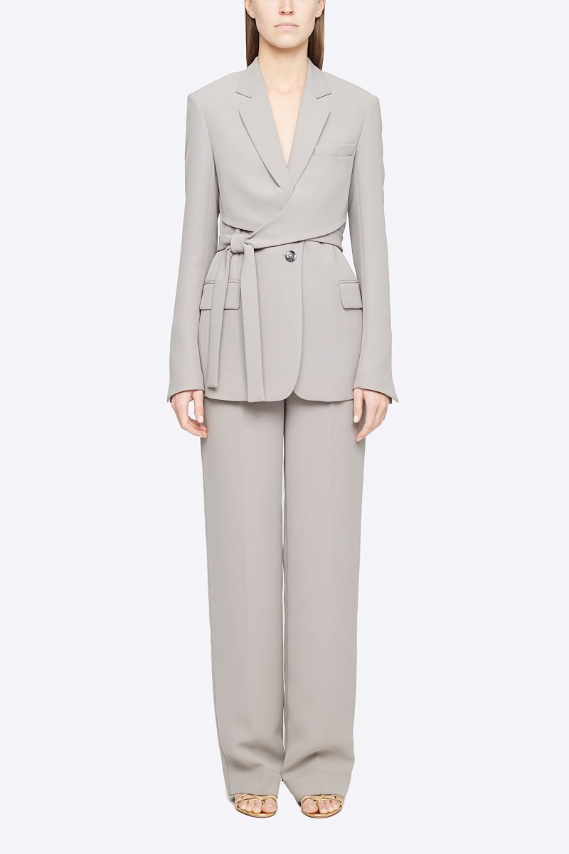 Heavy Cady Wrap Blazer-grey #0 Heavy Cady Wrap Blazer, Grey single-breasted wrap blazer from 3.1 PHILLIP LIM featuring notched lapels, front button fastening, long sleeves, jetted chest pocket, side tie fastening, central rear vent and two front flap pockets. POSITIVELY CONSCIOUS: This product is made with a material widely recognised as being better for the planet, so you can be confident you are choosing positively .- 4