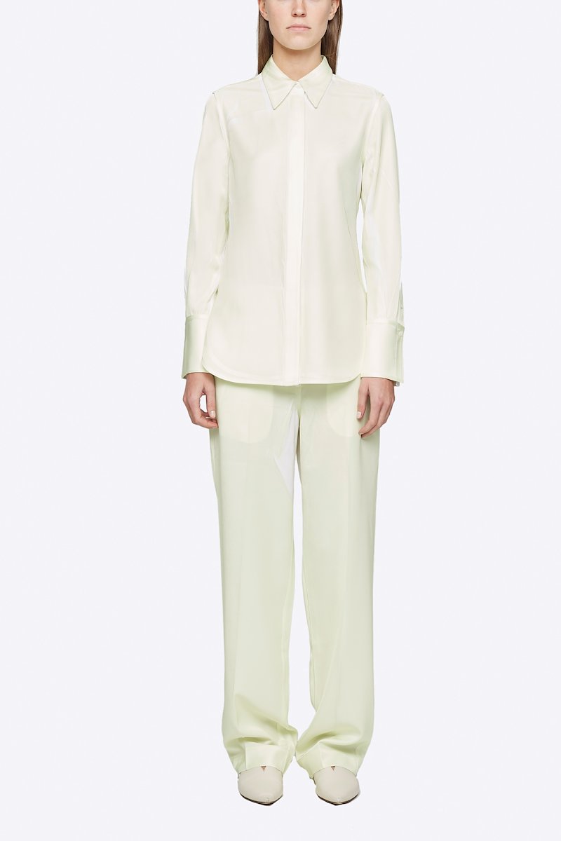 Overprinted Button Down Blouse-white #1 Overprinted Button Down Blouse, There's no bad day a great outfit can't fix. Detailed with a concealed front button placket, this pale yellow and white shirt from 3.1 Phillip Lim will brighten up your wardrobe and your days. Feeling better yet? Featuring a spread collar, long sleeves, button cuffs and a curved hem. POSITIVELY CONSCIOUS: This product is made with a certified eco-material or a recycled material that is better for the planet, so you can be confident you are choosing positively.- 5
