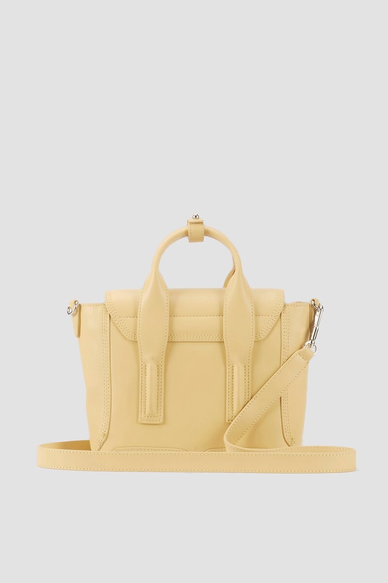 Pashli Mini Satchel, Wheat yellow calf leather small Pashli tote bag from 3.1 PHILLIP LIM featuring tonal stitching, zip details, silver-tone hardware, internal logo stamp, main compartment, internal zip pocket, foldover top, push-lock fastening, two rounded top handles and detachable shoulder strap.- 2