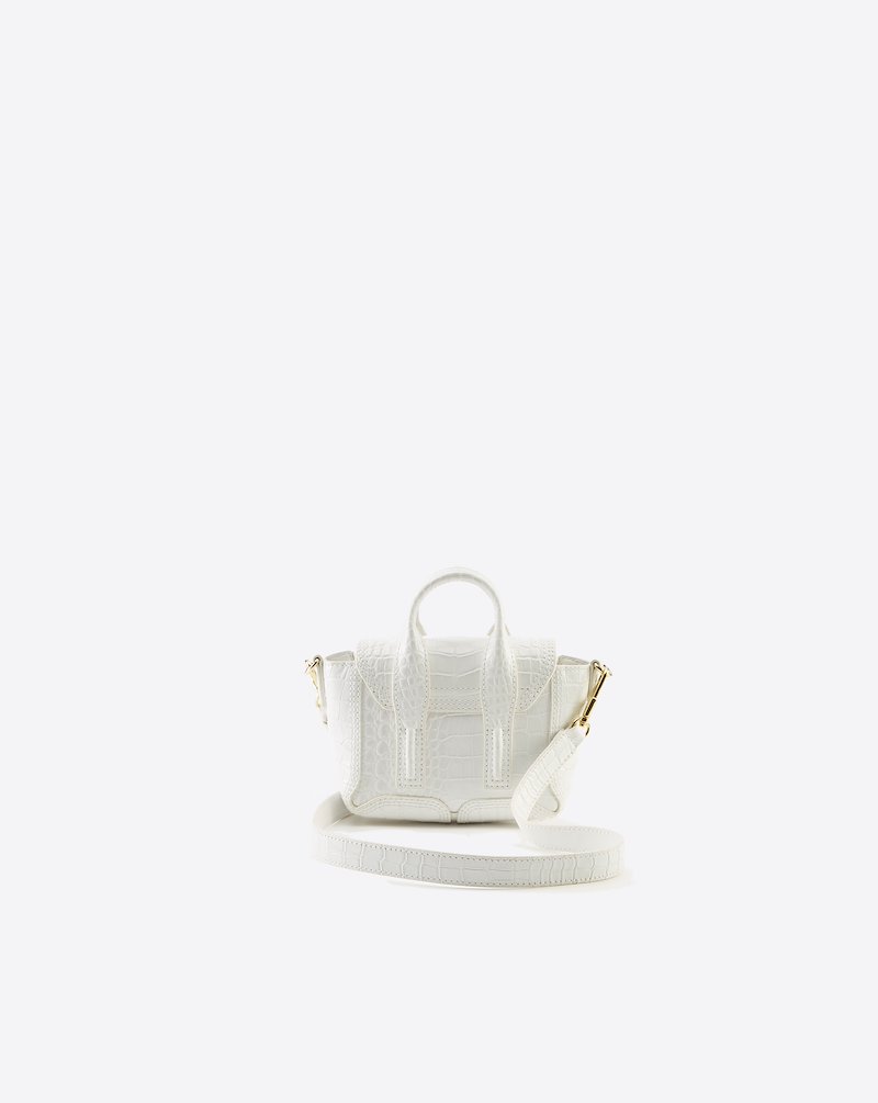 Pashli Nano Satchel-white #1 Pashli Nano Satchel, Need more proof that the best gifts in life come in the smallest of packages? This Pashli Nano crossbody bag from 3.1 Phillip Lim might just be what Shakespeare had in mind when he wrote: "though she be but little, she is fierce." It packs a punch - and your favourite lipstick. Featuring an embossed crocodile effect, gold-tone hardware, a chain and leather strap, a foldover top with magnetic closure and internal slip pockets.- 1