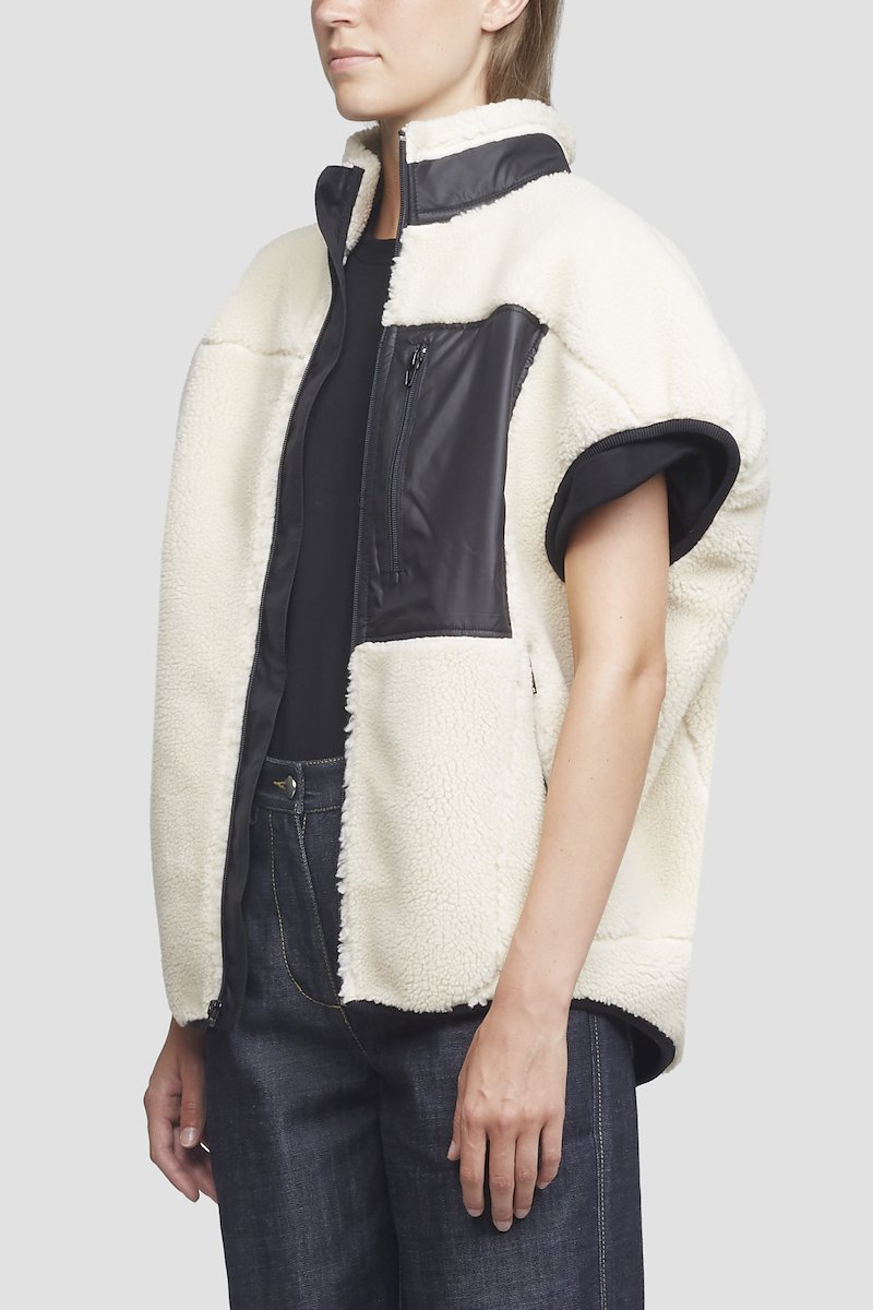 Sherpa Bonded Cocoon Vest-white #1 Sherpa Bonded Cocoon Vest, Ivory white/black sherpa bonded cocoon vest from 3.1 PHILLIP LIM featuring stand-up collar, cap sleeves, tonal stitching, front zip fastening, front zip fastening pockets and curved hem.- 1