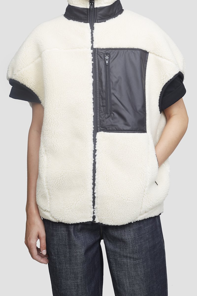 Sherpa Bonded Cocoon Vest-white #1 Sherpa Bonded Cocoon Vest, Ivory white/black sherpa bonded cocoon vest from 3.1 PHILLIP LIM featuring stand-up collar, cap sleeves, tonal stitching, front zip fastening, front zip fastening pockets and curved hem.- 3