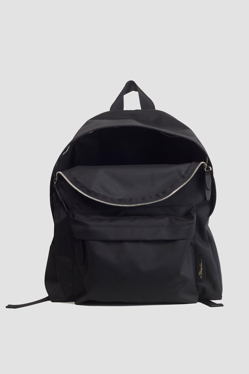The Deconstructed Backpack-black #1 The Deconstructed Backpack, Black logo-patch Deconstructed backpack from 3.1 PHILLIP LIM featuring logo patch to the front, top zip fastening, two padded adjustable shoulder straps, single rounded top handle and front zip-fastening compartment.- 3