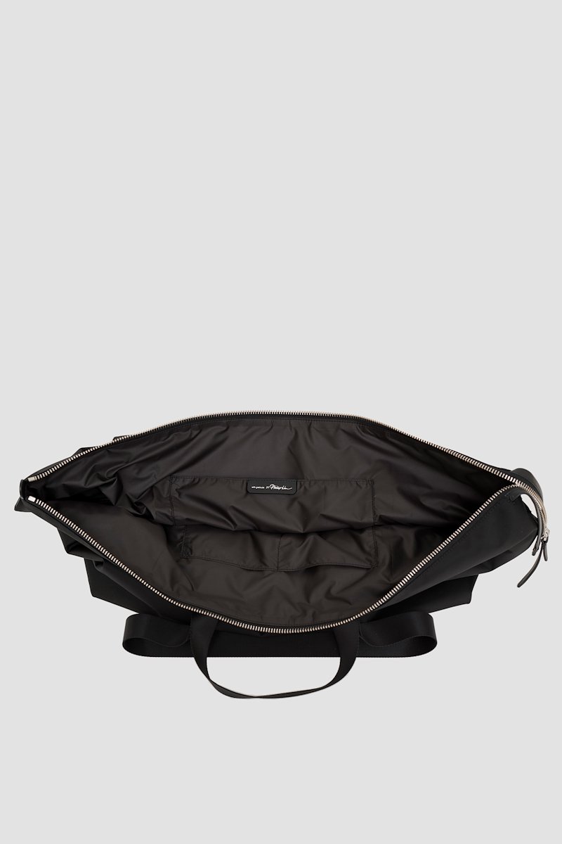 The Deconstructed Duffle Bag-black #0 The Deconstructed Duffle Bag, Black Deconstructed duffle bag from 3.1 PHILLIP LIM featuring leather trim, two top handles, two long top handles and top zip fastening.- 2