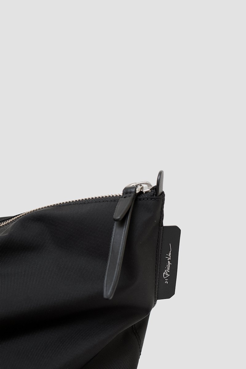 The Deconstructed Duffle Bag-black #1 The Deconstructed Duffle Bag, Black Deconstructed duffle bag from 3.1 PHILLIP LIM featuring leather trim, two top handles, two long top handles and top zip fastening.- 3