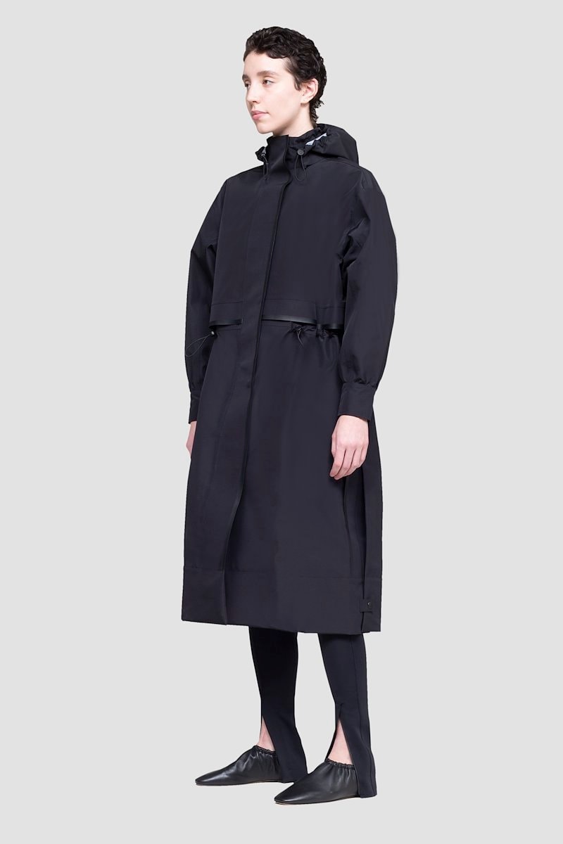The Essential Parka, Black Essential hooded parka coat from 3.1 PHILLIP LIM featuring drawstring hood, stand-up collar, long sleeves, storm flap, drawstring waist, concealed front button fastening, wind-resistant and water-resistant.- 1