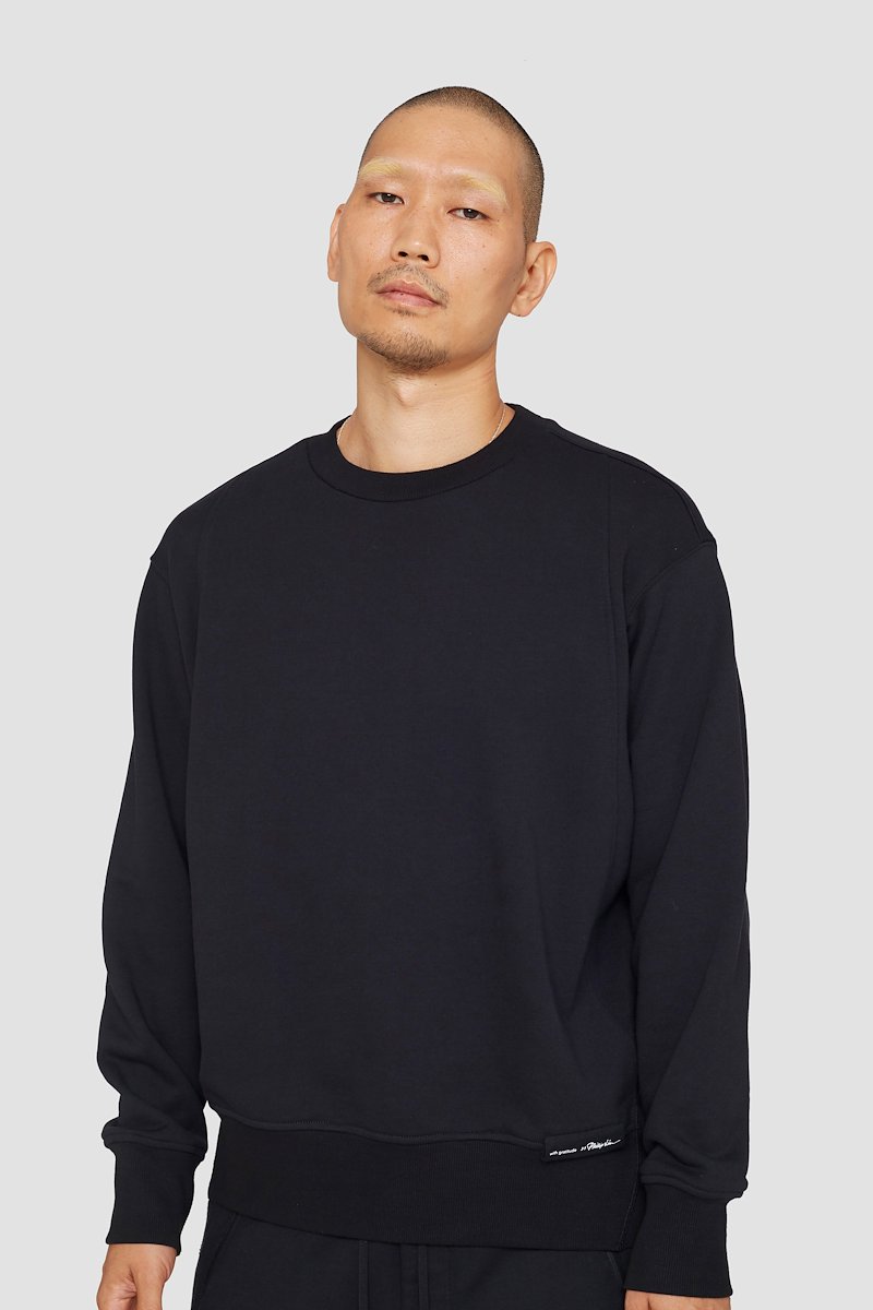 The Everyday Crew Sweatshirt-black #1 The Everyday Crew Sweatshirt, True black cotton Everyday sweatshirt from 3.1 PHILLIP LIM featuring ribbed detailing, logo patch to the front, crew neck, long sleeves, elasticated cuffs and straight hem.- 3