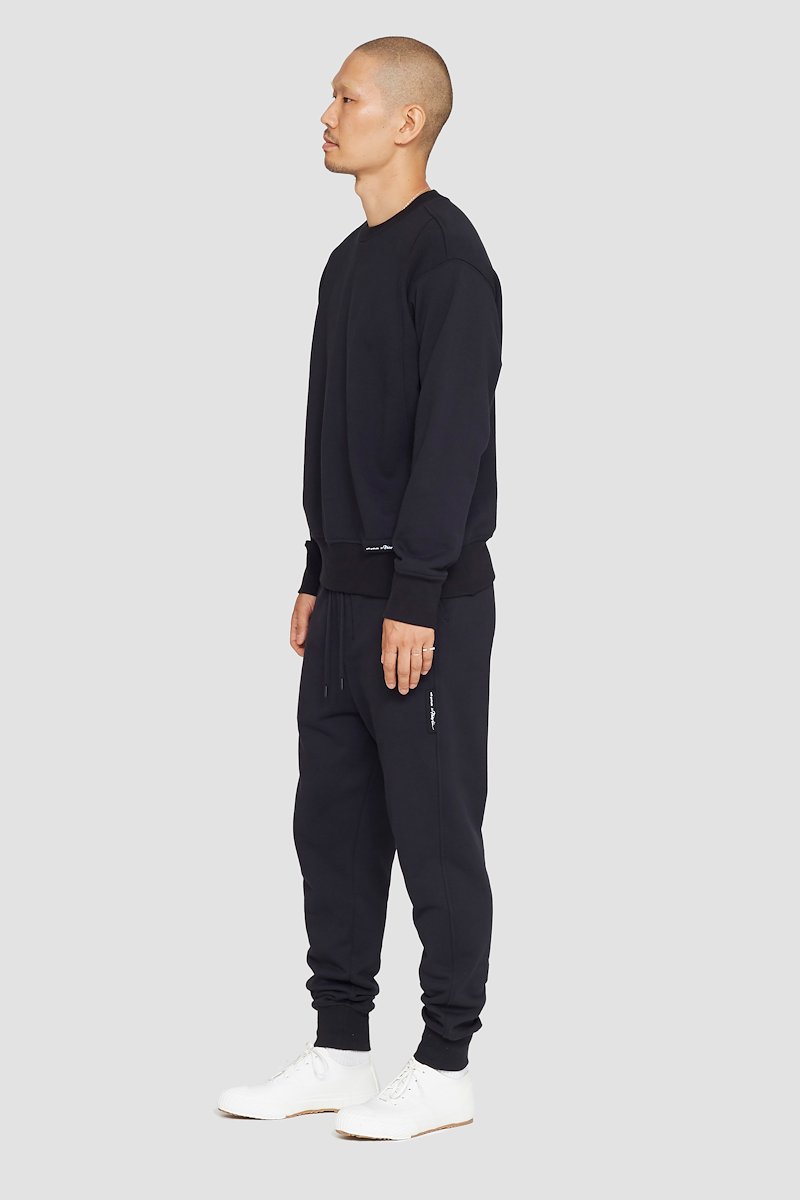 The Everyday Crew Sweatshirt-black #1 The Everyday Crew Sweatshirt, True black cotton Everyday sweatshirt from 3.1 PHILLIP LIM featuring ribbed detailing, logo patch to the front, crew neck, long sleeves, elasticated cuffs and straight hem.- 1