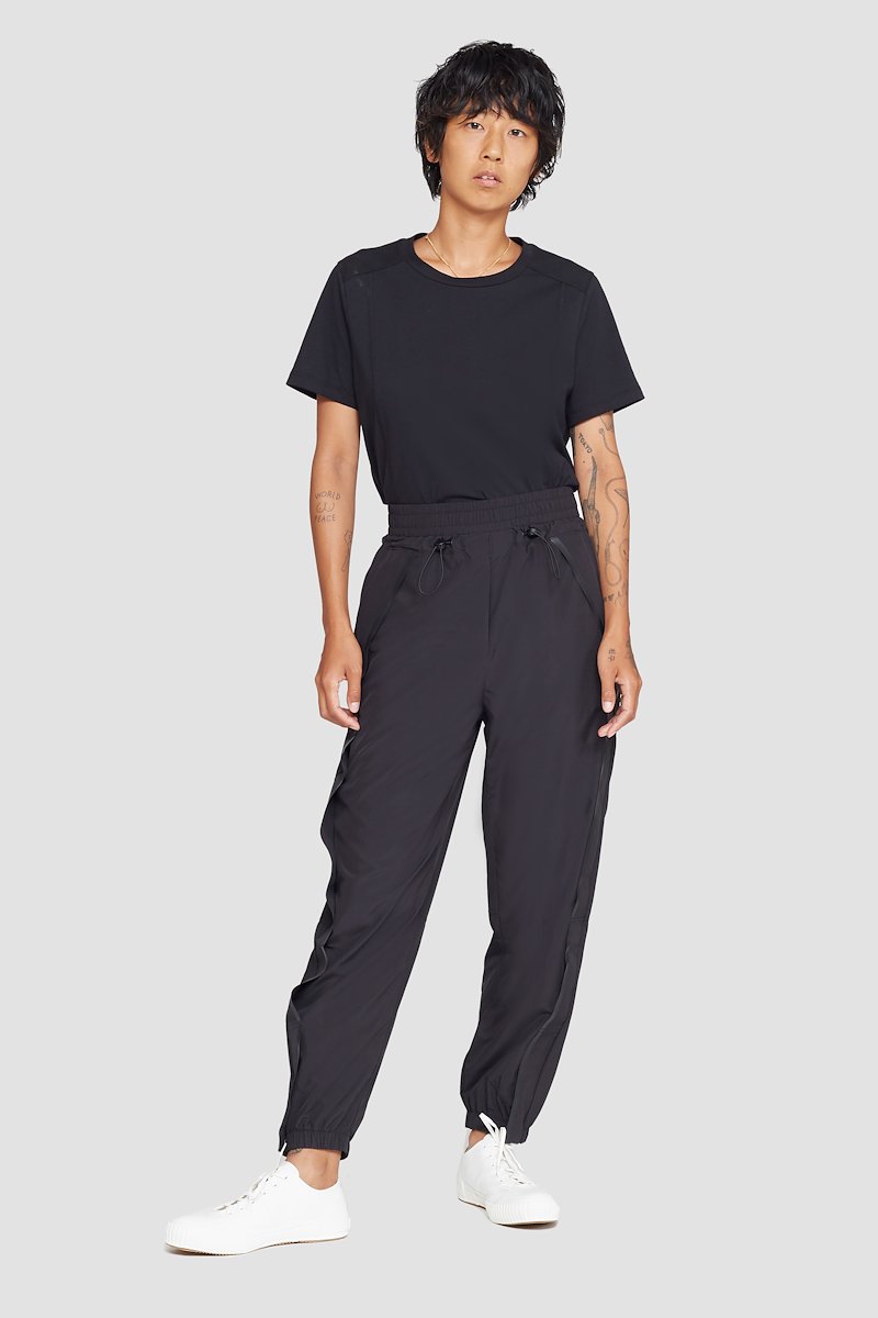 The Track-Less Pant-black #0 The Track-Less Pant, Black Track-less cropped track pants from 3.1 PHILLIP LIM featuring mid-rise, elasticated drawstring waistband, two side slit pockets and elasticated cuffs.- 0