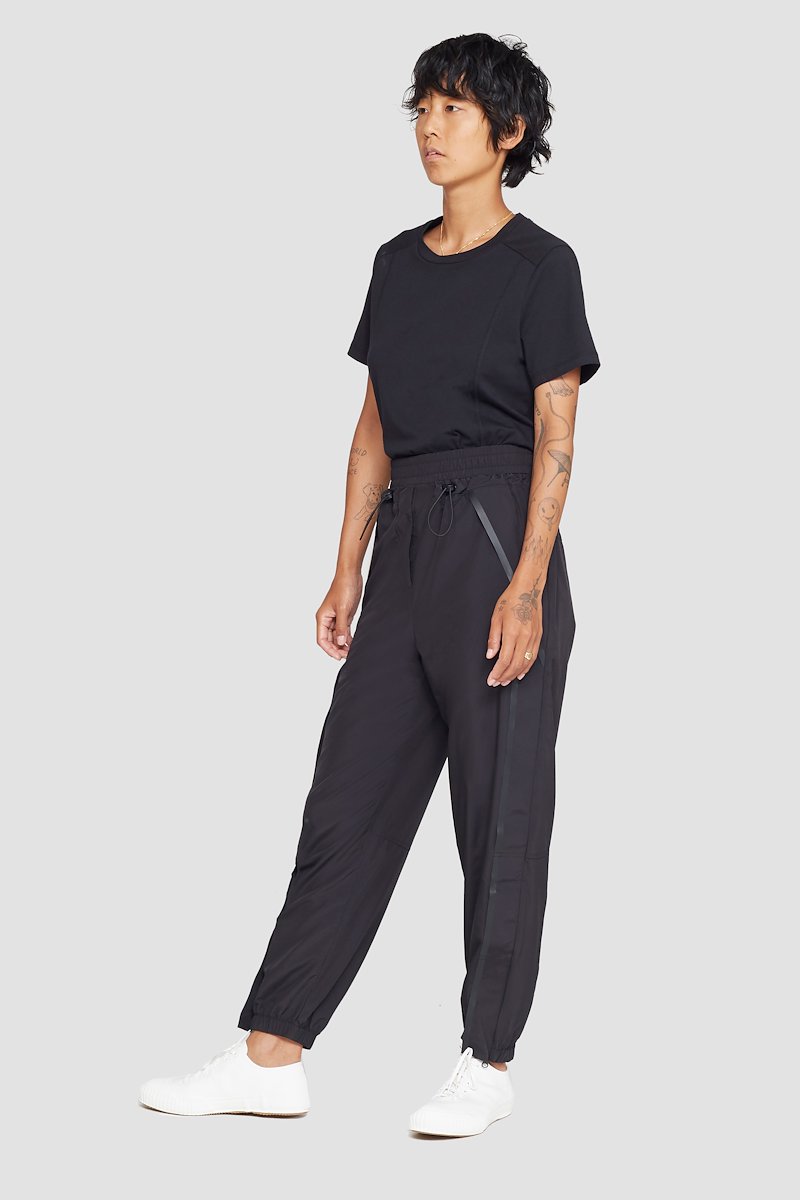 The Track-Less Pant-black #1 The Track-Less Pant, Black Track-less cropped track pants from 3.1 PHILLIP LIM featuring mid-rise, elasticated drawstring waistband, two side slit pockets and elasticated cuffs.- 1