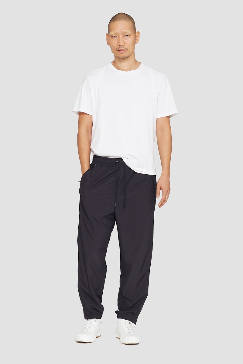 The Track-Less Pants-black #0 The Track-Less Pants, Black Track-Less pants from 3.1 PHILLIP LIM featuring tapered leg, elasticated drawstring waistband, two side slit pockets, rear welt pocket, zip details and elasticated ankles.- 0