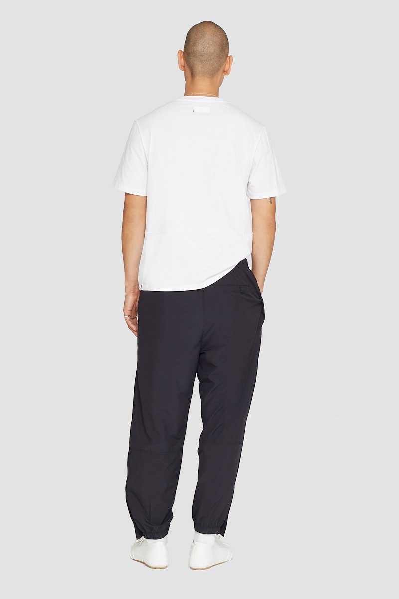 The Track-Less Pants, Black Track-Less pants from 3.1 PHILLIP LIM featuring tapered leg, elasticated drawstring waistband, two side slit pockets, rear welt pocket, zip details and elasticated ankles.- 2