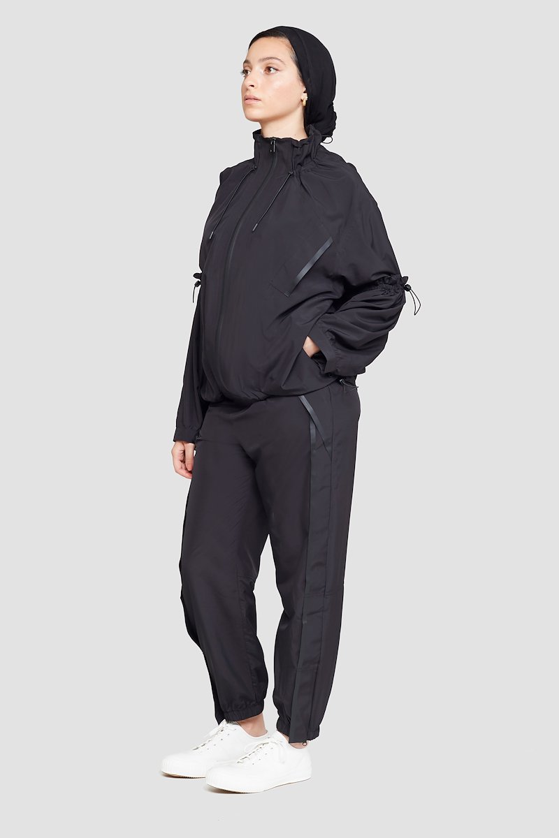 The Win-Breaker-black #1 The Win-Breaker, Black drawstring-detail jacket from 3.1 PHILLIP LIM featuring drawstring fastening, two slit pockets at the chest, buttoned-cuff sleeves, front zip fastening and long sleeves.- 1