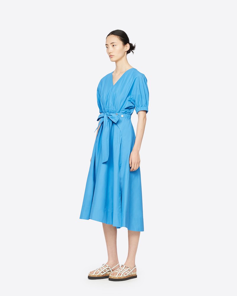 Utility Belted Dress with Gathered Sleeves-blue #1 Utility Belted Dress with Gathered Sleeves, There's nothing you love more than matching things. Matching your pen with your notebook, your headphones with your (reusable) bottle and matching your dress with that blue sky. Opt for this Utility belted midi dress from 3.1 Phillip Lim. Featuring a v-neck, an asymmetric hem, a mid-length, a flared style, short puffed sleeves, tie waist belt and silver-tone snap-button details.- 1