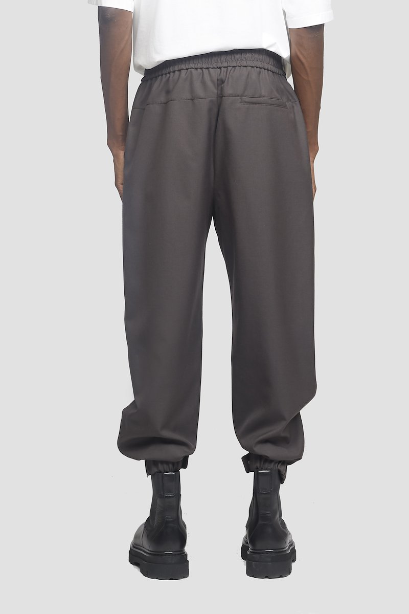 Wool Serge Jogger-grey #0 Wool Serge Jogger, Earth grey Serge wool-blend jogger from 3.1 PHILLIP LIM featuring exposed-seam detailing, elasticated waistband, elasticated cuffs, buttoned cuffs, two side slit pockets and rear welt pocket.- 2