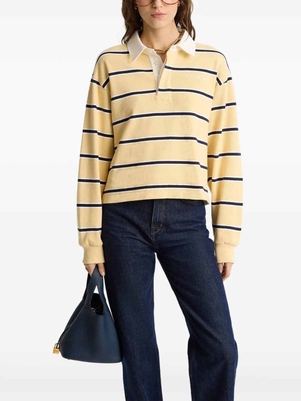 Sporty & Rich Poloshirt met Serif-logo Geel