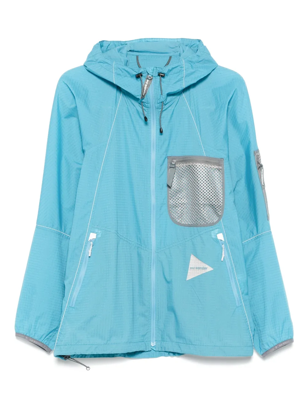 And Wander Breath Rip jack met capuchon en mesh zak Blauw