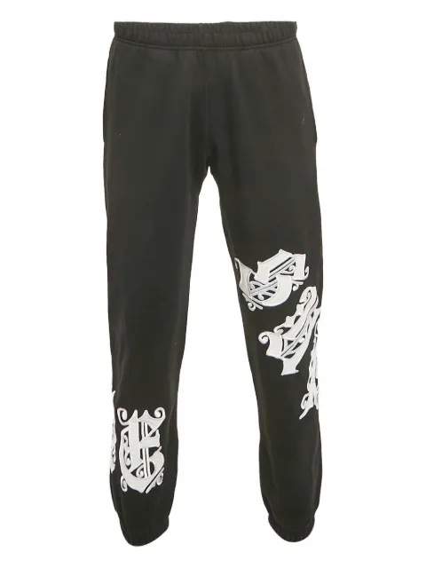 Supreme logo-appliqué knitted trousers
