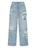 AMIRI distressed patchwork jeans - Blue