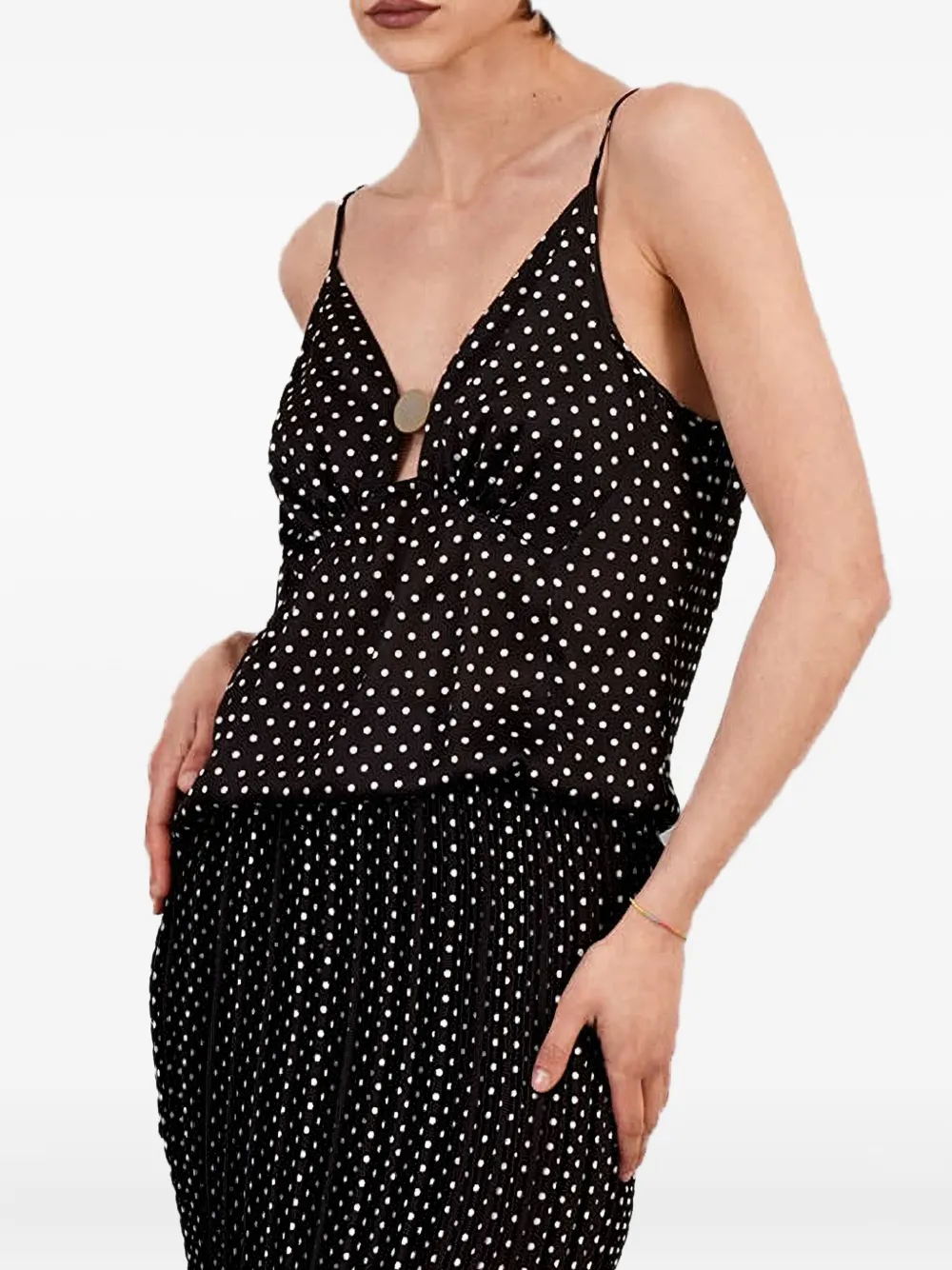 SIMONA CORSELLINI Top met stippen en knoopdetail Zwart