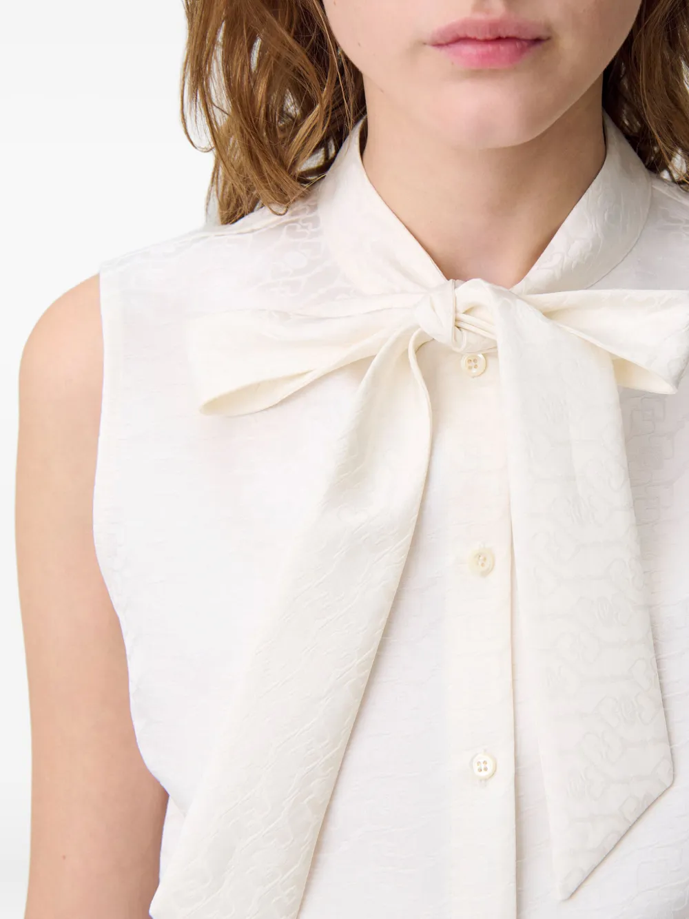 Claudie Pierlot Mouwloze top met strikhals Ecru